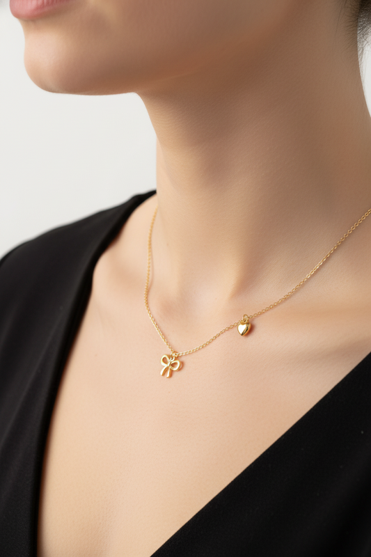 R1-68 718 GOLD BOW AND HEART NECKLACE