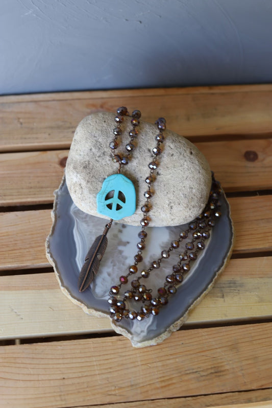 102367 R2-17 BRONZE CRYSTAL NECKLACE W/ PEACE AND FEATHER