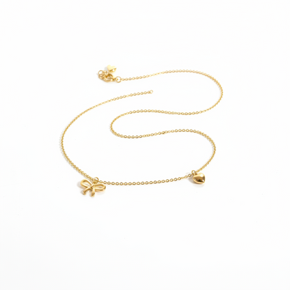 R1-68 718 GOLD BOW AND HEART NECKLACE