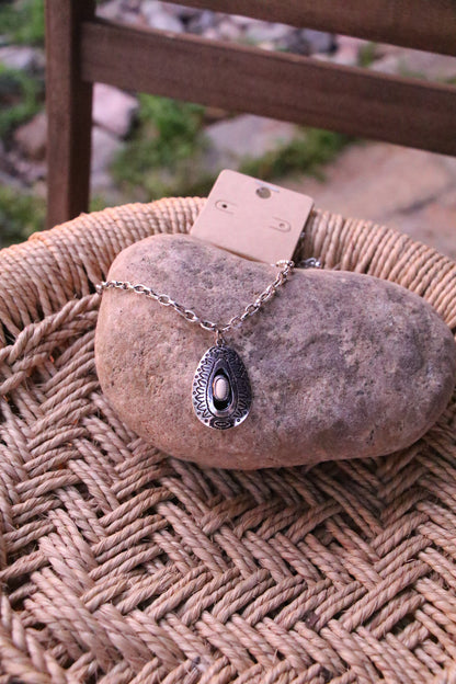 0502 TEARDROP PENDANT NL W/ BONE CENTER T147